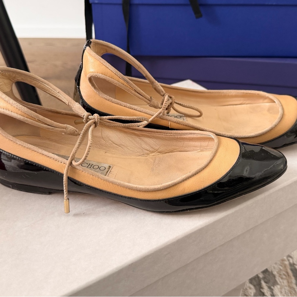Jimmy Choo Black and Tan Flats with Bow Accent